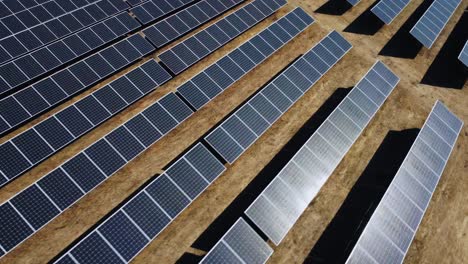 Solar-Power-Plant,-Array-of-Solar-Panels,-Dynamic-Dramatic-Drone-Aerial-View
