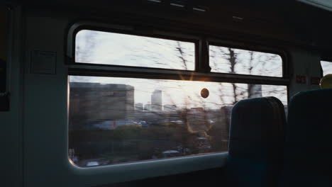 Cinematic-shot-looking-out-window-on-train-at-sunrise