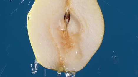 Detail-of-pear-slice-with-water-falling-on-the-piece-in-slow-motion
