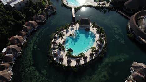 Aerial-View-of-Pools,-Bungalows-and-Lagoon-on-Caribbean-Sea,-Mexico