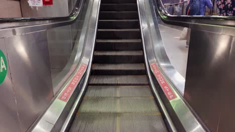 isolated-moving-escalator-going-down-from-low-angle-at-morning-video-is-taken-at-new-delhi-metro-station-new-delhi-india-on-Apr-10-2022