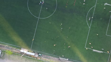 Top-View-Of-Soccer-Football-Training-At-Buenos-Aires-Club-at-sunset,-Argentina