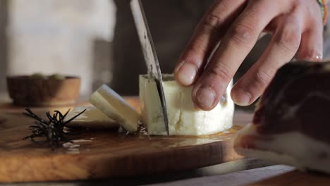 Cutting-cheese-on-a-wooden--board