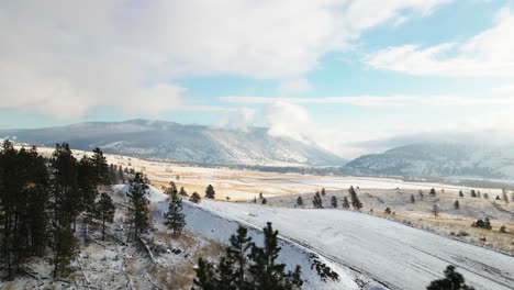 The-Grasslands-of-the-Nicola-Valley-covered-in-light-snow-on-a-partly-cloudy-day-in-the-winter-with-sunshine-in-Merritt,-BC-Canada
