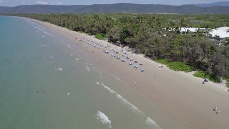 Aerial-View-Over-Four-Mile-Beach-With-People-Enjoying-Summer-Holidays-In-Port-Douglas,-Australia---drone-shot