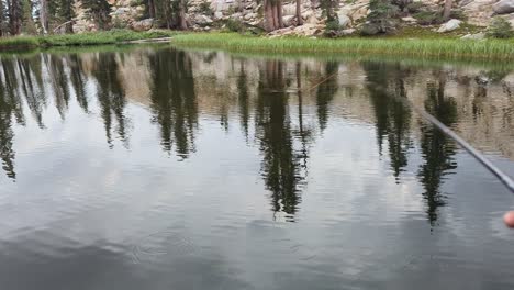 First-Person-View-of-a-fly-fishing-Rod-while-Trout-jump-out-of-the-water