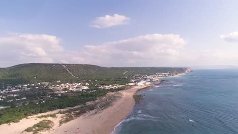 Panning-aerial-view-over-natural-reserve-and-coast-of-Los-Canos-de-Meca-in-Spain