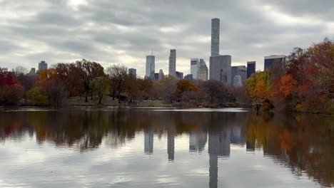 Turtle-Pond-in-Central-Park,-New-York-on-Cloudy-Autumn-Day-With-Midtown-Manhattan-Skyscrapers-in-Background,-Panorama