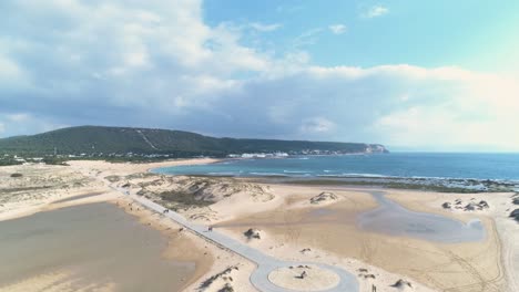 Establishing-aerial-view-of-touristic-beach-and-natural-reserve-in-Cadiz-Spain