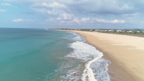Beautiful-aerial-view-of-blue-sea-and-holiday-beach-destination-in-Cadiz-Spain