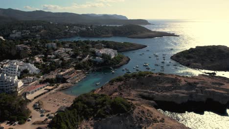 Wide-angle-aerial-view-Portinatx-town-and-beach-on-coast-of-Ibiza