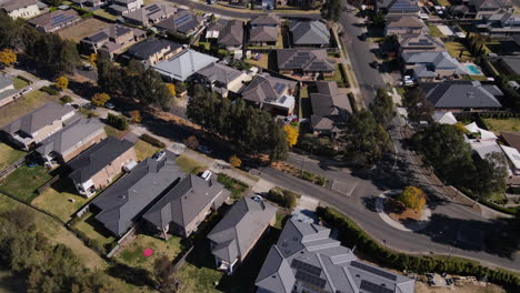 High-drone-shot-of-new-Australian-suburb-by-rivere---large-houses-on-estate