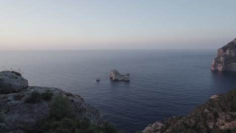4k-drone-shot-flying-along-shore-of-Ibiza-with-rocky-jagged-coastline