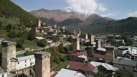 Aerial-view-residential-and-Caucasus-mountain-in-background,-Svaneti,-Georgia