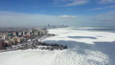 Aerial-view-of-the-south-side-of-Chicago,-sunny,-winter-day-in-Illinois,-USA---descending,-drone-shot