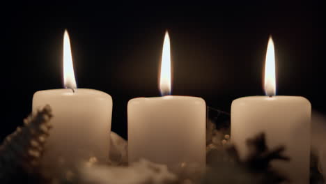 Three-Burning-Candles-in-Row-Blown-Out-in-Slow-Motion