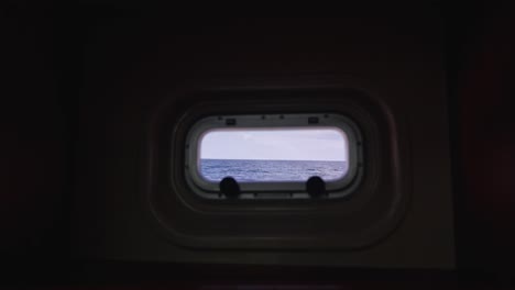 Seascape-view-from-cabin-porthole-window-during-navigation