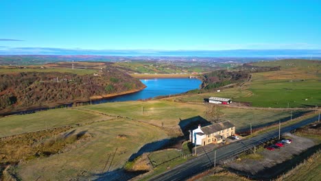 Winter-aerial-drone-footage-of-Scammonden-Reservoir-with-the-M62-motorway-bridge