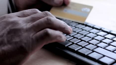 making-an-online-purchase-with-a-credit-card-on-her-laptop-stock-video-stock-footage