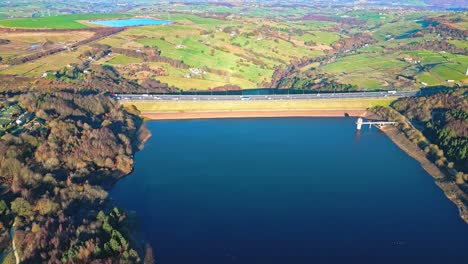 Winter-aerial-footage-scene-of-Scammonden-Reservoir-with-the-M62-motorway-bridge