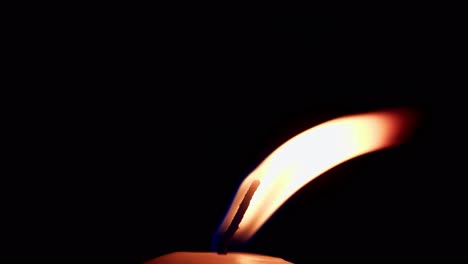Closeup-of-candle-flame-on-black