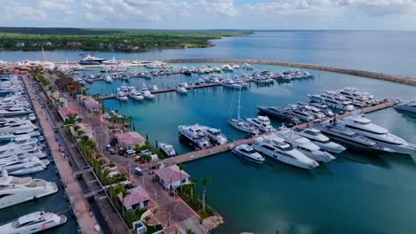 Aerial-flyover-marina-with-luxury-sailing-boat-and-yachts-in-La-Romana,-Dominican-Republic