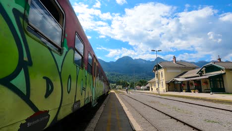 Diesel-red-train-leaving-Bohinjska-Bistrica-station-in-Slovenia