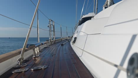 Pov-shot-walking-on-wooden-ground-on-luxury-yacht-on-sea,slow-motion