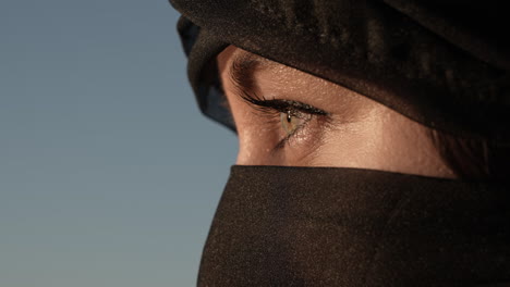 Young-Woman-in-Hijab-Opens-Her-Green-Eyes,-Revealing-Profile-Close-Up