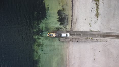 Drone-shot-of-boat-at-boat-ramp-in-lake-in-New-Zealand