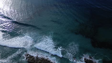 Overhead-View-Of-Ocean-Waves-During-Sunset-At-Playa-de-Caion-In-Galicia,-Spain