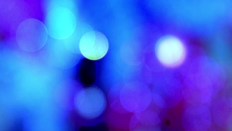 Put-of-focus-blurred-Christmas-lights-shining-in-background-with-cold-colours