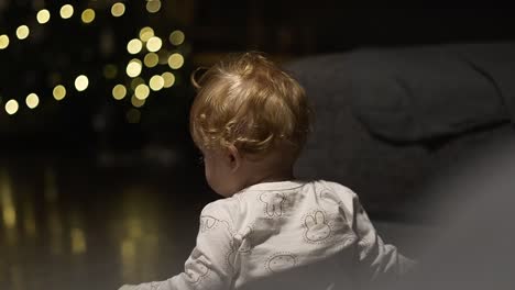 Baby-girl-playing-and-crawling-during-christmas