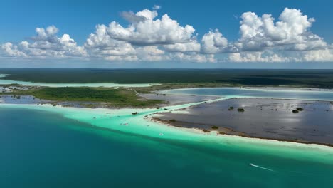 Aerial-view-following-a-boat-passing-the-Pirates-channel-at-the-Bacalar-lagoon,-in-sunny-Mexico