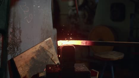 Close-Up-Shot-Of-Blacksmith-Machine-Beating-Incandescent-Hot-Iron