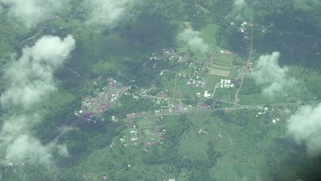Above-clouds-view-of-rural-Costa-Rica-with-roads-and-urbanization,-Aerial-top-view-shot