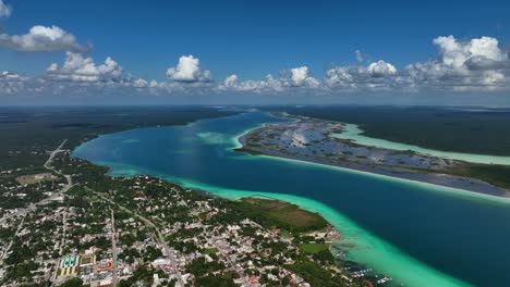 Aerial-view-overlooking-the-Bacalar-lagoon-and-the-village,-in-Quintana-Roo,-Mexico