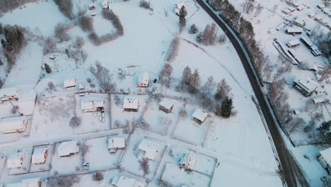A-Snow-Covered-Residential-Roofs-During-Winter-Of-Sunrise