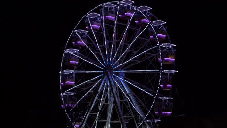 Colorful-lighting-on-a-ferries-wheel-observation-view-point-of-city-square-at-night