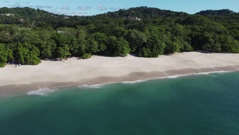 Aerial-view-of-a-the-tropical-and-paradisiacal-Conchal-beach-in-the-Guanacaste-region,-Costa-Rica