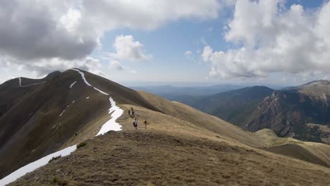 Hikers-walking-along-the-ridge-of-a-mountain-in-the-Spanish-Pyrenees