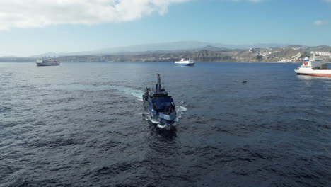 Aerial-shot-approaching-a-customs-police-boat-at-close-range,-a-unit-used-to-fight-drug-trafficking
