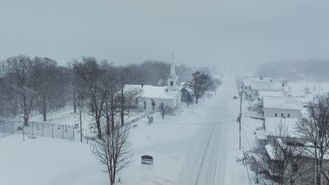 Monson-community-church-in-heavy-snowfall-Realtime-Aerial