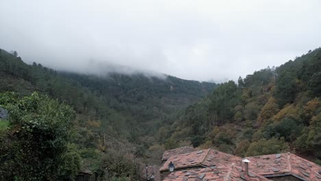 Landscape-of-foggy-forest-valley,-view-from-Cerdeira-xisto-schist-shale-village-in-Lousa,-Portugal