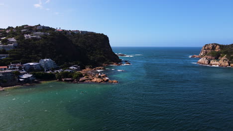 Descending-aerial-past-small-white-lighthouse-at-The-Heads-of-Knysna-Lagoon