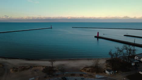 A-small-boat-departing-the-Muskegon-Channel-in-the-great-lake,-Lake-Michigan