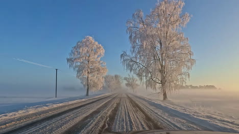 Cinematic-POV-shot-of-a-driver-driving-on-a-road-covered-with-fresh-snow-during-Christmas-holiday