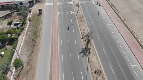 Aerial-shot-of-car-and-motorbike-running-in-the-highway-of-gawadar-balochistan