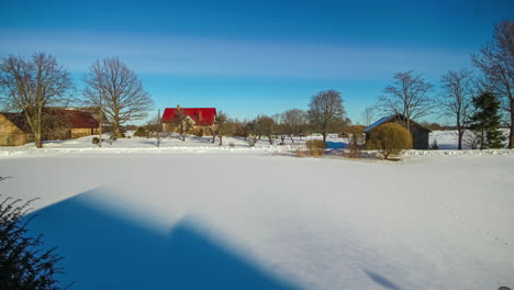 Timelapse-shot-from-snow-covered-winter-to-green-vegetation-during-spring-time-along-rural-countryside