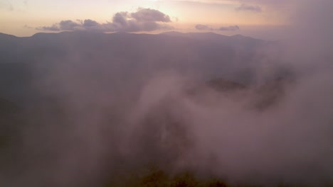 aerial-push-through-clouds-at-sunset-in-blue-ridge-and-Appalachian-mountain-range